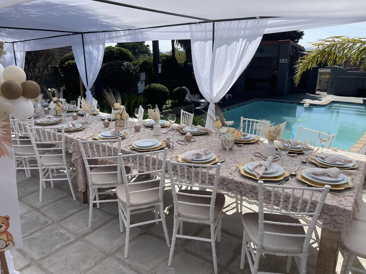The Poolside Venue — poolside function table set for a baby shower
