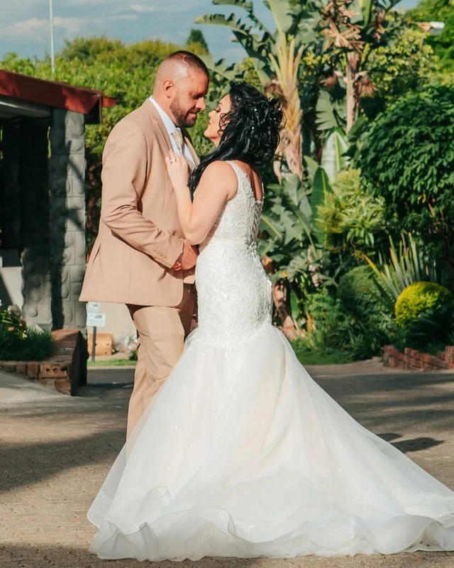 A couple in the garden, with ample space for wedding photography